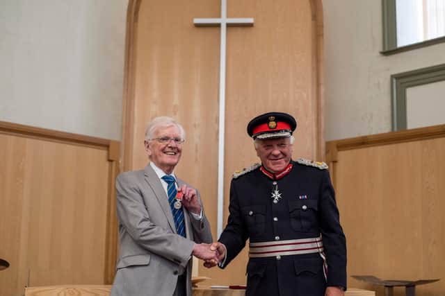 Peter Maddison receives his medal Lord Lieutenant of Lincolnshire Toby Dennis. Photo: Holly Parkinson