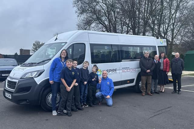 Staff and students of St Lawrence School, Philip Sharpe, David Rhodes, Kathryn Pinder and Michael Gill. Photo: Mortons Media Group.