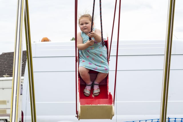 Highflyer Phoebe Parrinder, 4, enjoying the swings.