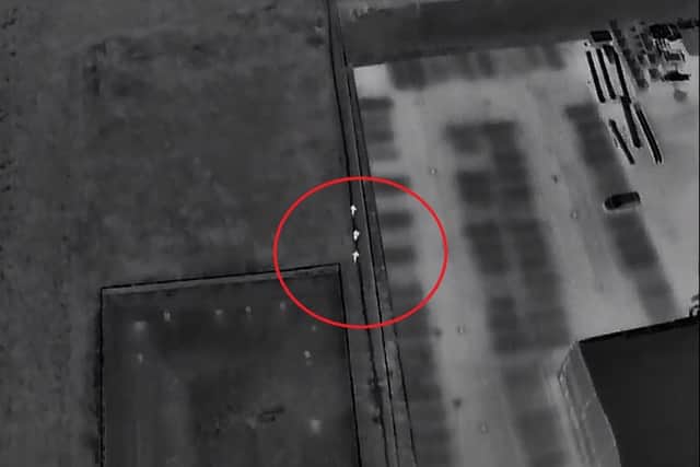 A screenshot of the drone footage showing the offenders (circled) attempting to escape. Photo: YouTube