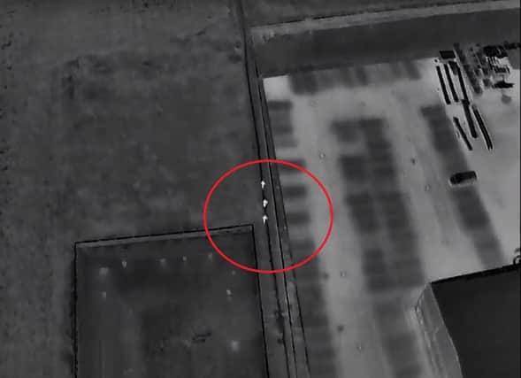 A screenshot of the drone footage showing the offenders (circled) attempting to escape. Photo: YouTube