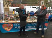 Favourite Market Trader Amanda receives her prize from Cllr Grist in 2021's competition.