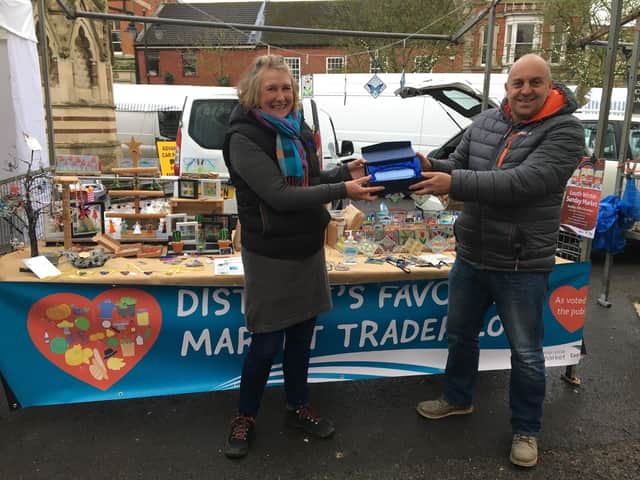 Favourite Market Trader Amanda receives her prize from Cllr Grist in 2021's competition.