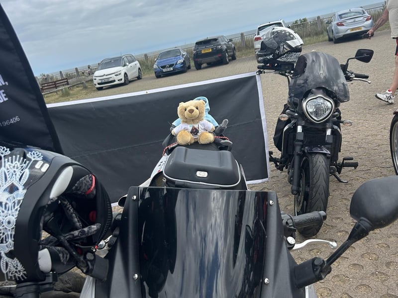 Kibi Bear strapped to the pillion of one of the bikes.