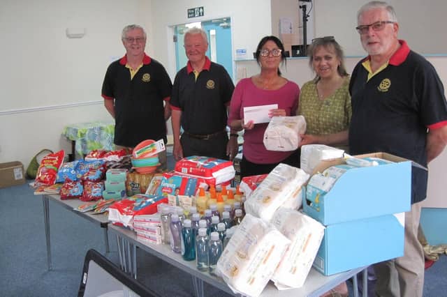 Rasen Rotarians donate to the local Baby Bank. Eve Bennett who runs the charity, with Rotarians Bowman, Myland and Anderson (quiz organizer) along with President Dianne Tuckett.