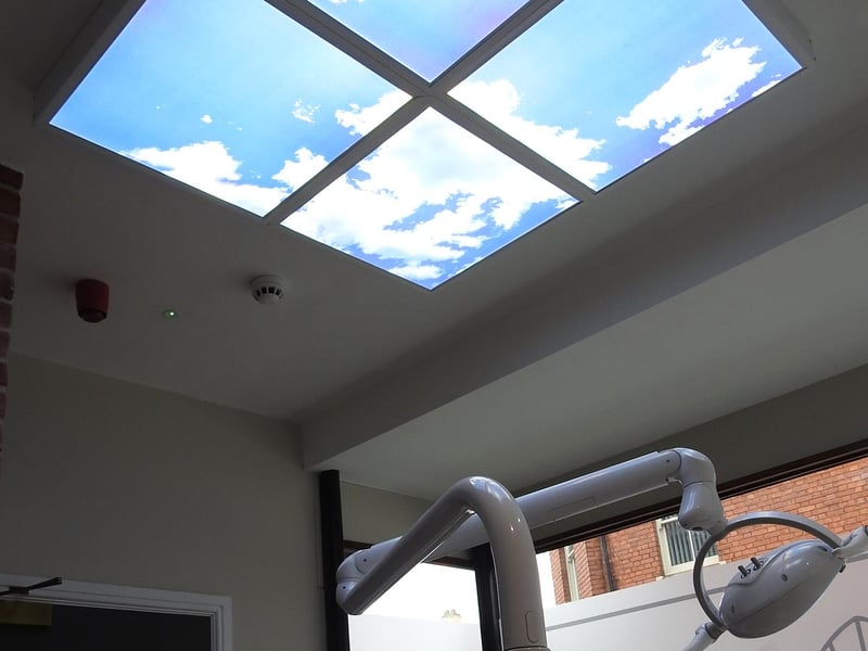 Stylish sky murals on the ceilings of the new dental surgeries.
