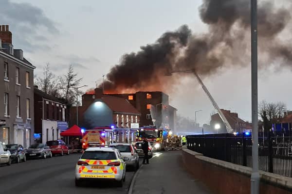 The plume of orange flame and black smoke can be seen across Boston after the fire in a derelict building on London Road. Photo: David Seymour