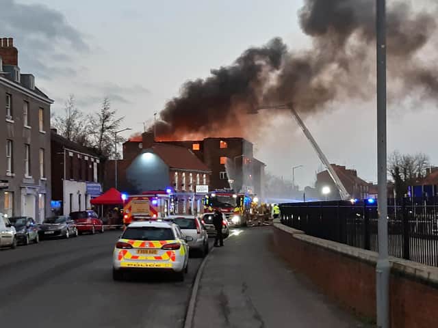 The plume of orange flame and black smoke can be seen across Boston after the fire in a derelict building on London Road. Photo: David Seymour