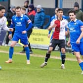 Action from Trinity's FA Trophy exit to Woking on Saturday.