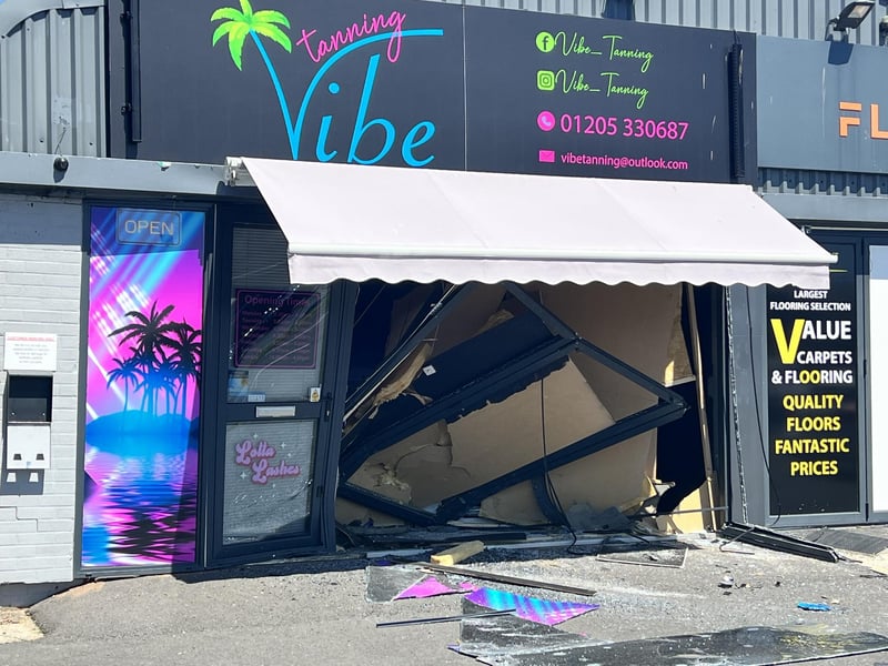 The damage shop front of the tanning salon in Boston. Photo: David Dawson
