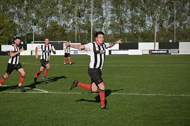 Scott Phillips celebrates one of his goals against Rossington. Photo: Brigg Town FC.