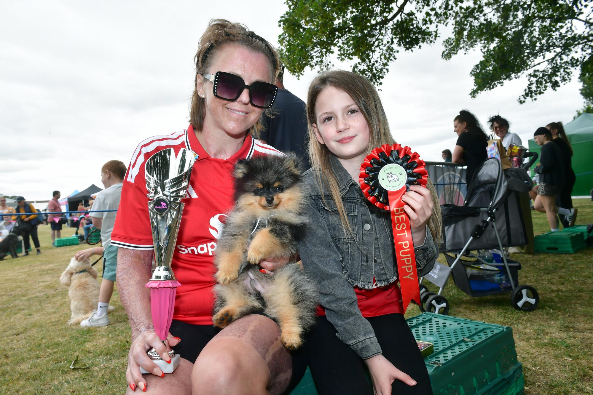 Kim Leighton and Skyla Leighton, 10, with Lenny, winner of Best Puppy