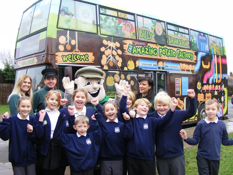 Billinghay Primary School playing host to an educational bus run by Branston Potatoes. Since its launch in September 2014, Billy Branston’s Amazing Potato Factory had welcomed more than 3,000 children to learn about potatoes and their journey from farm to fork. Pupils are pictured with (from left) Frankie Salkeld, Anton Dean, mascot Billy Branston and Josine Griffiths.