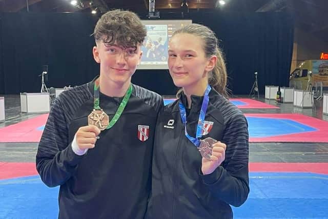 Cody Glen and Connie Dwyer in Riga with their medals.