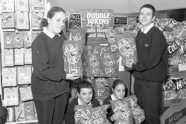 Pupils from Boston's Haven High School at the town's Asda supermarket as part of McVities' Big Sum competition. Haven High had teamed up with the store in the hope of winning a computer for the school through the competition. The more 12-packs of McVities' Hula Hoops sold in store, the greater the chance that Haven High would win the kit. As part of the competition, pupils also had to work out the volumes of crisps sold by looking at sales figures. Pictured are pupils Vicki Poelstra, Natalie Hudson, Martin Moon and Freddie Jewell.