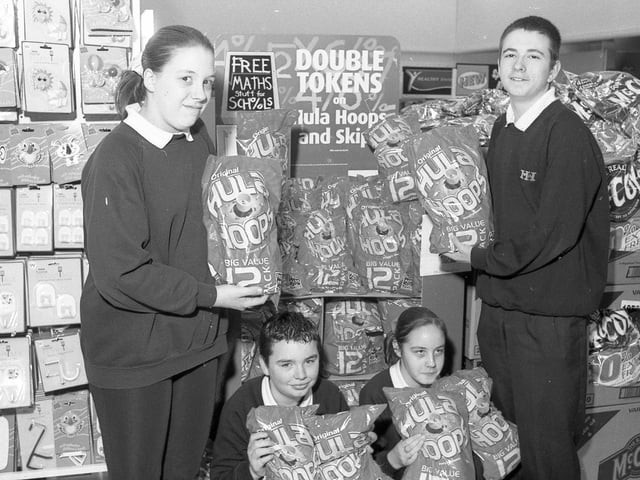 Pupils from Boston's Haven High School at the town's Asda supermarket as part of McVities' Big Sum competition. Haven High had teamed up with the store in the hope of winning a computer for the school through the competition. The more 12-packs of McVities' Hula Hoops sold in store, the greater the chance that Haven High would win the kit. As part of the competition, pupils also had to work out the volumes of crisps sold by looking at sales figures. Pictured are pupils Vicki Poelstra, Natalie Hudson, Martin Moon and Freddie Jewell.