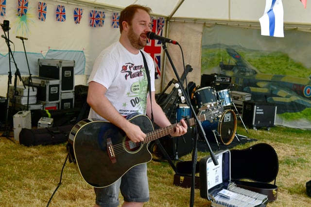 Charlie Russell performing at the concert marquee.