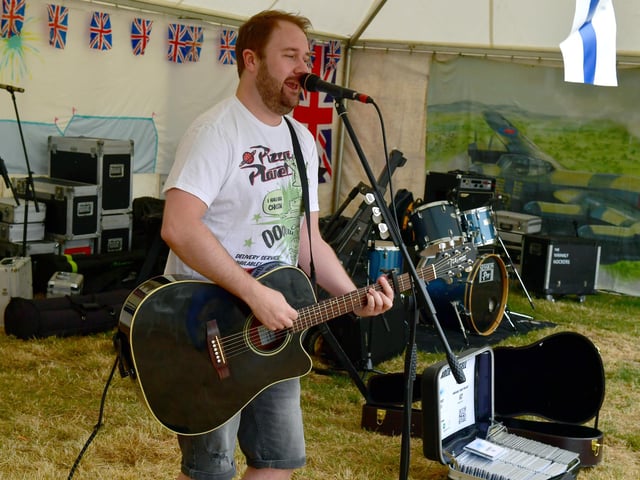 Charlie Russell performing at the concert marquee.
