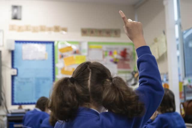 File photo dated 27/11/19 of school children during a class at a primary school, as teaching assistants are taking second jobs or leaving education to work in better-paid roles amid cost-of-living pressures, a report by The National Foundation for Educational Research suggests.