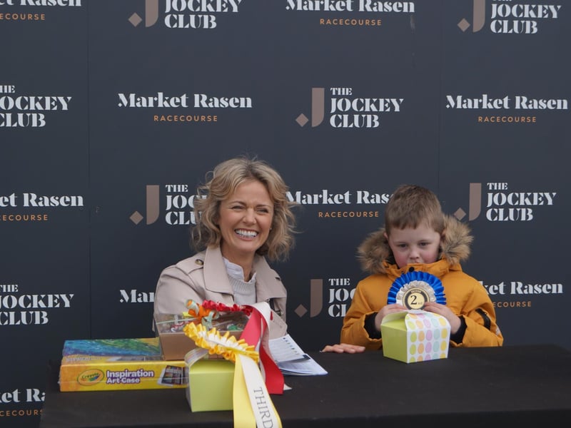 George Silburn received his second place prize in the Easter Egg Drawing competition