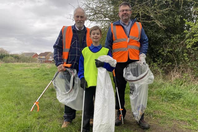 Councillors Mike Clarke and Richard Wright with Dominic Hunter, nine. Photo: NKDC