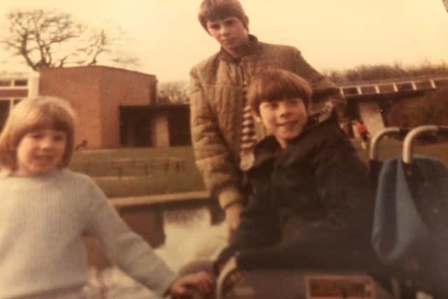 Graham with his younger brother, Andrew, and sister, Debbie in 1983.