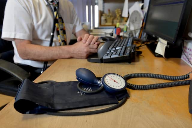 File photo dated 10/09/14 of a GP at their desk. GP appointments over the phone or online can miss serious illnesses and put patients at risk, according to a new study. Researchers said mistakes via remote consultation are rare, but there is a risk of patients being under-diagnosed, GPs being swayed by what has been said previously, and less qualified staff not acting on signs of illness. Issue date: Wednesday November 29, 2023.