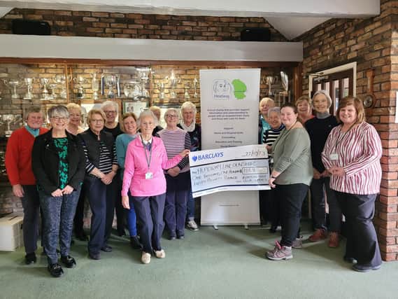Pictured holding the cheque are Val, from Boston Golf Club (left) and Ann-Marie, from Headway Lincolnshire.