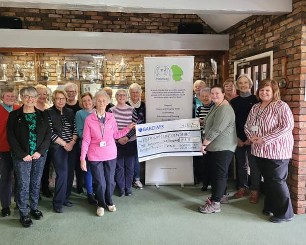 Pictured holding the cheque are Val, from Boston Golf Club (left) and Ann-Marie, from Headway Lincolnshire.