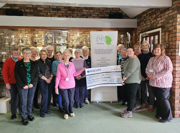 Pictured holding the cheque are Val, from Boston Golf Club (left) and Ann-Marie, from Headway Lincolnshire.