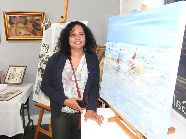 Sleaford Art Group member Divya Rajan with one of her paintings on show.