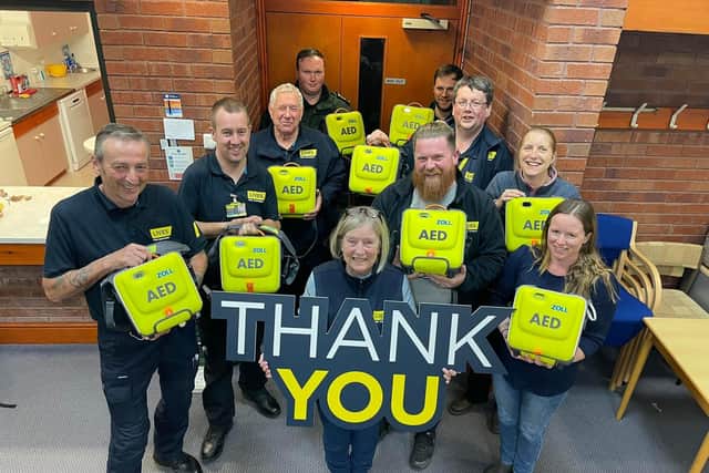 CDS Action Charitable Trust present defibrillators to LIVES.