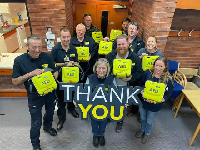 CDS Action Charitable Trust present defibrillators to LIVES.