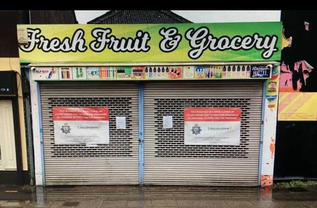 Posters from Lincolnshire Police have been placed on the shutters of the Fresh Fruit and Grocery store in Sleaford. Photo: Lincs Police