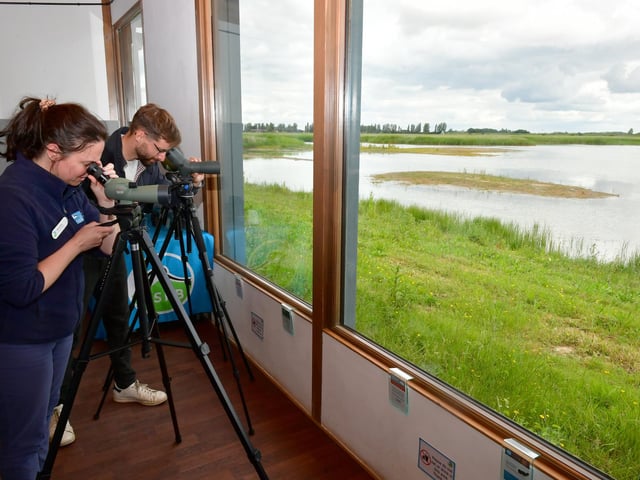 Hayley Roan - senior site manager for Titchwell Marsh, with visitor Conor Bridges