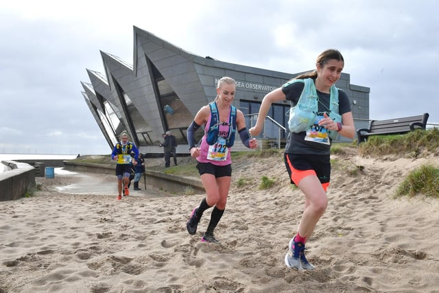 No time to stop for coffee - runners passing the North Sea Observatory.