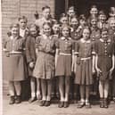 Horncastle Grammar School, Form 1A, photo 1947-1948Back row: left to right Irving Benton, Dennis Robinson, Alex Tointon, William Abbott.Third Row: John McAnlis, George Wells, Raymond Baxter, Peter King, Colin Smith, Joseph Austin Wilson, Michael Belton, and Peter Bourne.Second Row: Graham Brown, Iris Haw, Dorothy Langton, Janey Creswell, Josie Chapman, Dorothy Ironmonger, Kathleen Meanwell, Peggy McAnlis, and Francis Dawson.Front Row: Pat Parker, Ellen Pinchbeck, Jill Robinson, Margaret Oliver, Sheila Coldham, Margaret Dennis, Bridget Exton, and Terry Linton