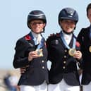 ​Ros Canter, left, with Laura Collett and Tom McEwen on the gold medal podium. Photo: Kevin C. Cox/Getty Images