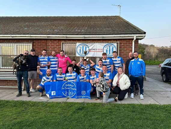 Sutton FC's team posing at Furlongs Field.