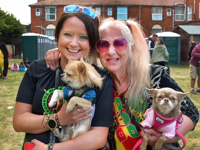 Zita and Anita Kelly enjoying the music with their dogs.