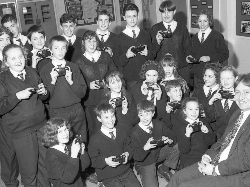 Pupils at Boston's Haven High posing for the camera with cameras of their own. The kit had been donated to the school through a partnership with Lloyds Bank. The youngsters are pictured with Simon Sperring, manager of Lloyds' Boston branch.