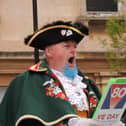 Sleaford Town Crier John Griffiths reads out the VE Day proclamation.