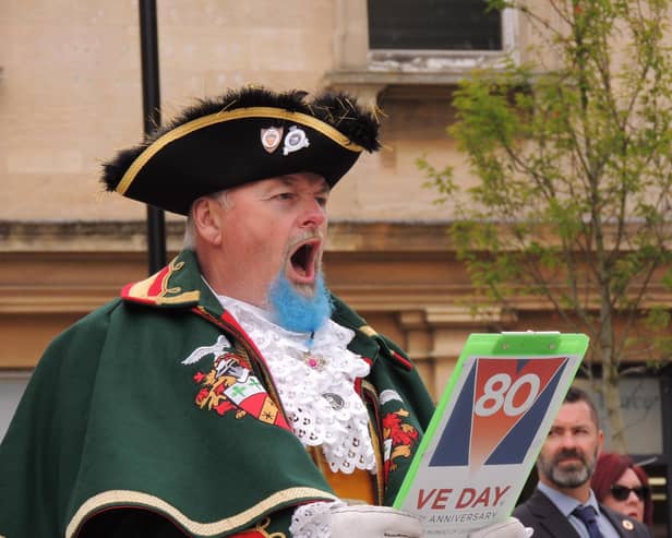 Sleaford Town Crier John Griffiths reads out the VE Day proclamation.