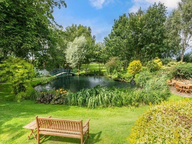 Seating areas beside the pond.