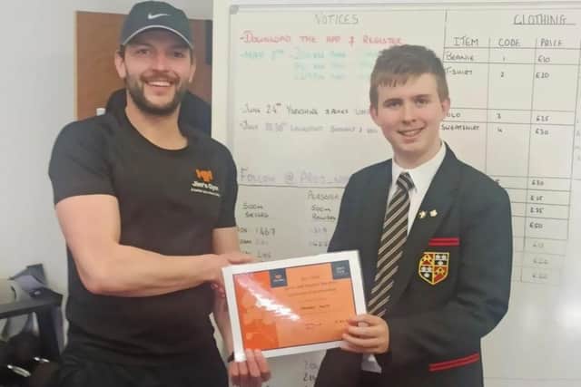 George Smith is awarded by Ade Smith of Jim's Gym.