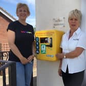 Caroline Dawson with Wendy Kalra of Ting Dene with the new defibrillator.
