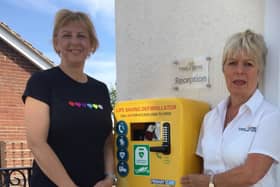 Caroline Dawson with Wendy Kalra of Ting Dene with the new defibrillator.