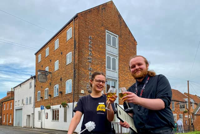Ashley Thurston and Kerian Wood from The Joseph Morton pub toast the pub's success in this year's Loo of The Year Awards. Photo: Chris Frear
