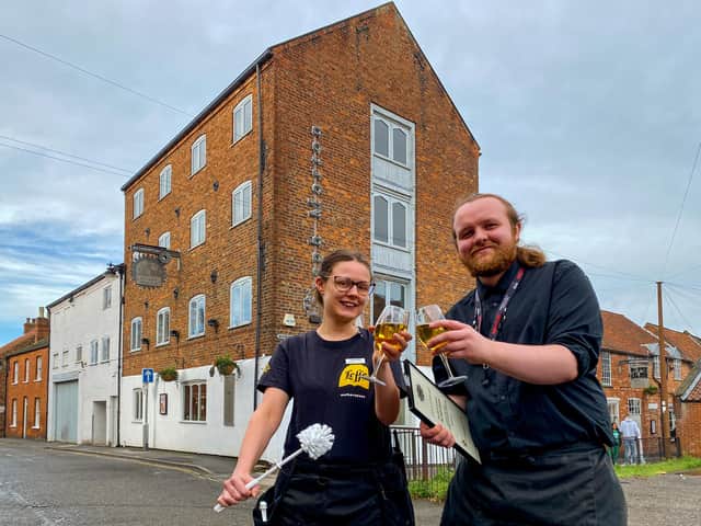 Ashley Thurston and Kerian Wood from The Joseph Morton pub toast the pub's success in this year's Loo of The Year Awards. Photo: Chris Frear