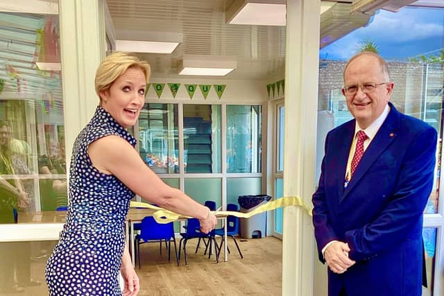 Former Chair of Governors Emma Davey (left) and current Chair Steve Woodcock (right) officially opening the new extension